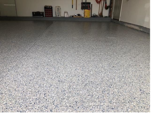 Blue and white flake epoxy garage floor